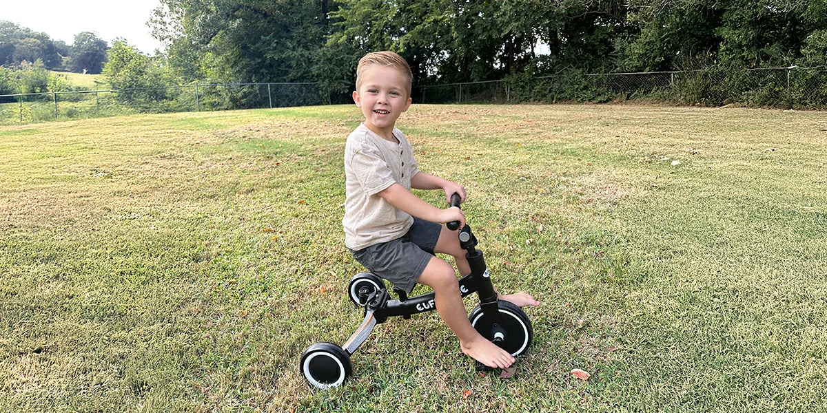 Which is more stable: a tricycle or a kid bike with removable training wheels?