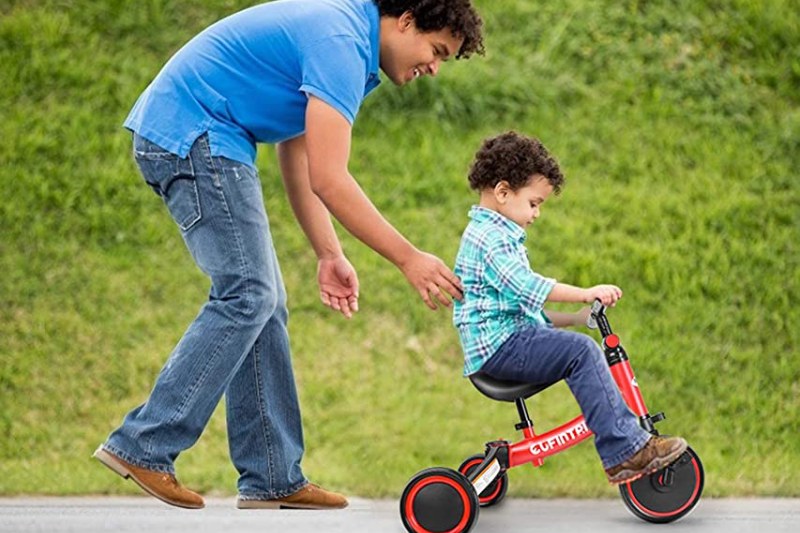 kids ride a tricycle