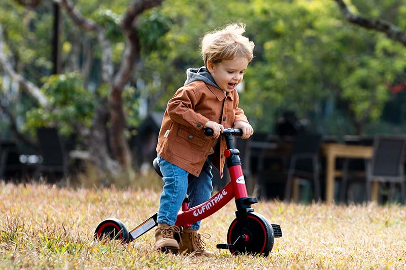 riding a toddler tricycle